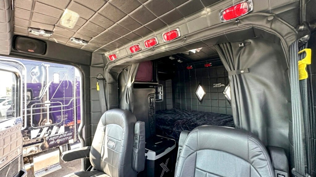 Peterbilt 389X sleeper cab interior with a bed and resting area